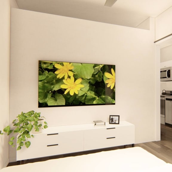 Thumbnail 12 of 12 a white bedroom with a painting of yellow flowers on the wall at Brownstones at Palisade Park Townhomes, Broomfield, 80023