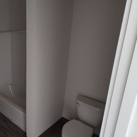 a bathroom with a toilet sink and bathtub
