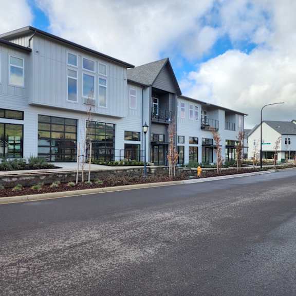 a row of new town houses on the side of a street