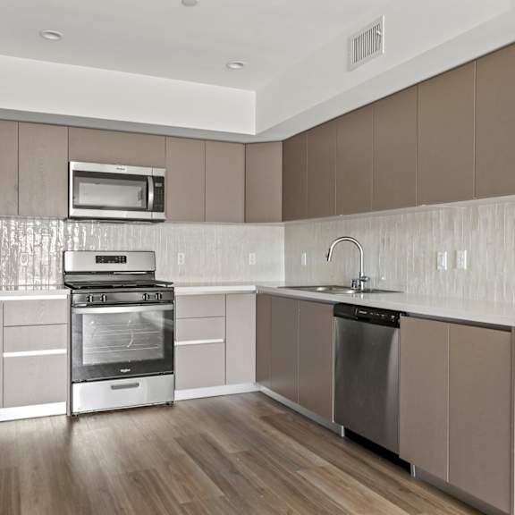 an illustration of a kitchen with a sink and a refrigerator