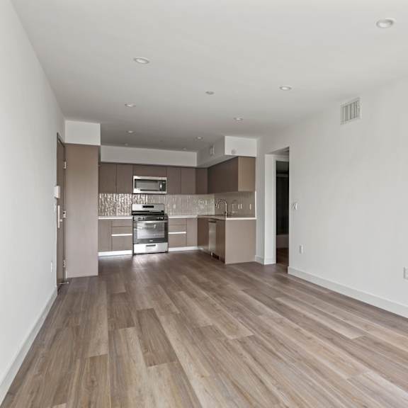 a renovated living room and kitchen in a new home