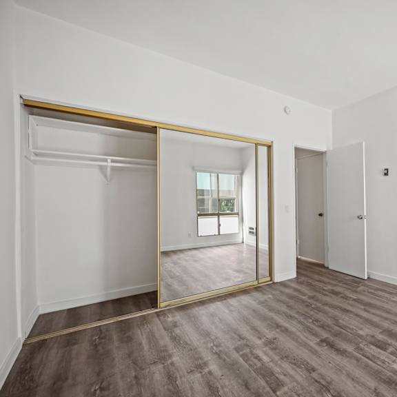 a room with a sliding door and a window.