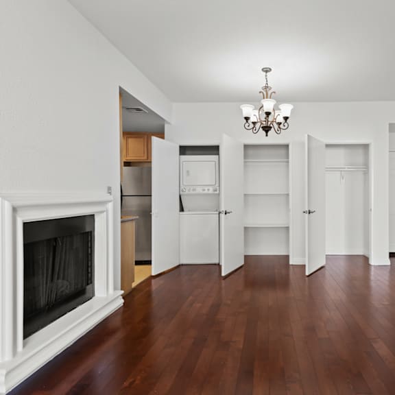 a living room with a fireplace and a wooden floor