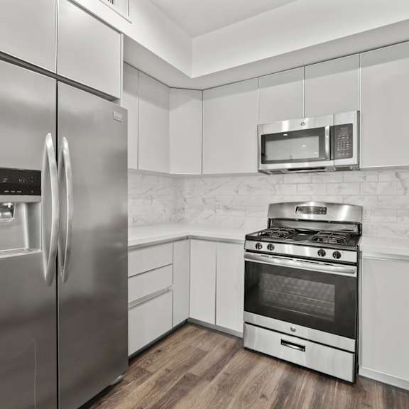 kitchen with stainless-steel refrigerator, stove, and microwave oven