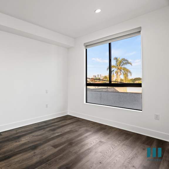 bedroom with large-size windows, recessed lighting, and vinyl flooring