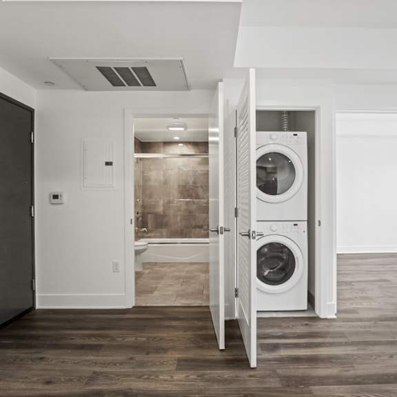 front entrance, hall bathroom, and in-suite washer & dryer