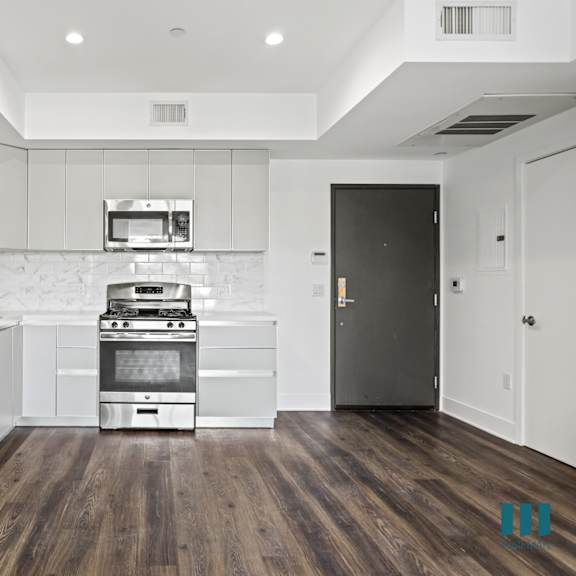front entrance and kitchen with energy-efficient appliances