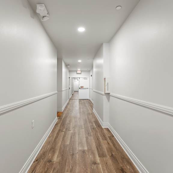 hallway with vinyl flooring