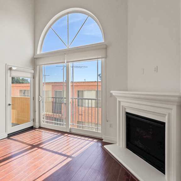 living room with electric fireplace and patio