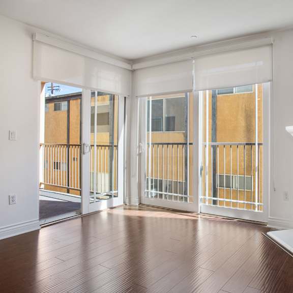 living room with electric fireplace, patio with window shades