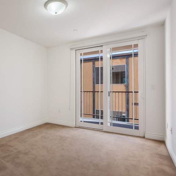 bedroom with balcony access