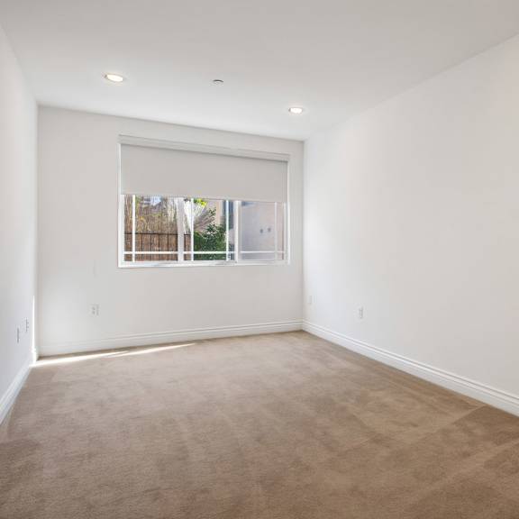 bedroom with recessed lighting and large-size windows