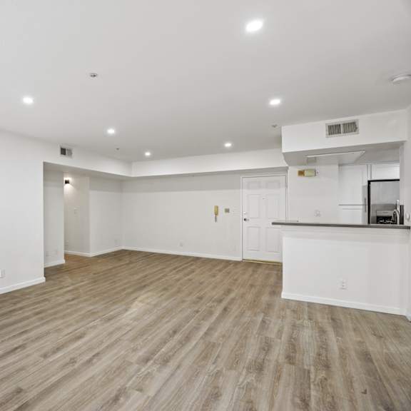 open-concept kitchen, dining, and living room areas