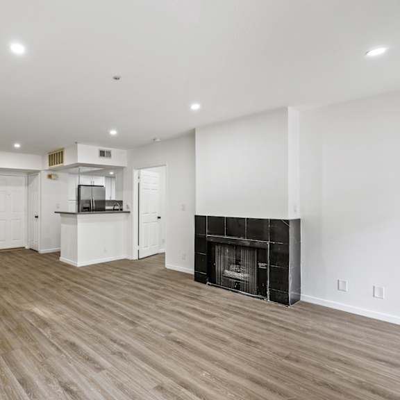 open-concept kitchen, dining, and living room areas