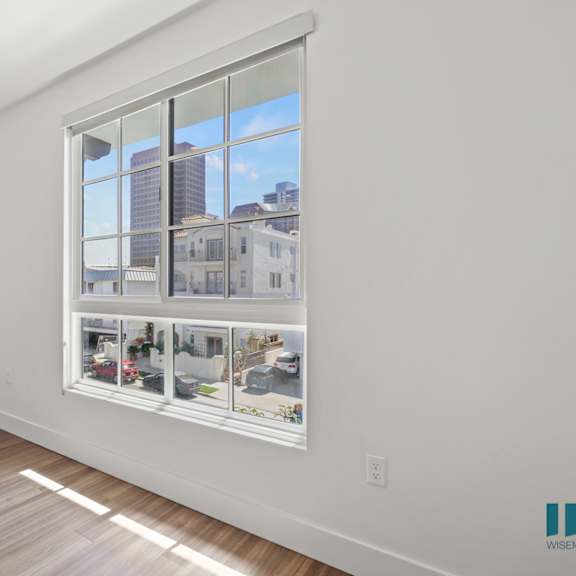 bedroom with windows and vinyl flooring
