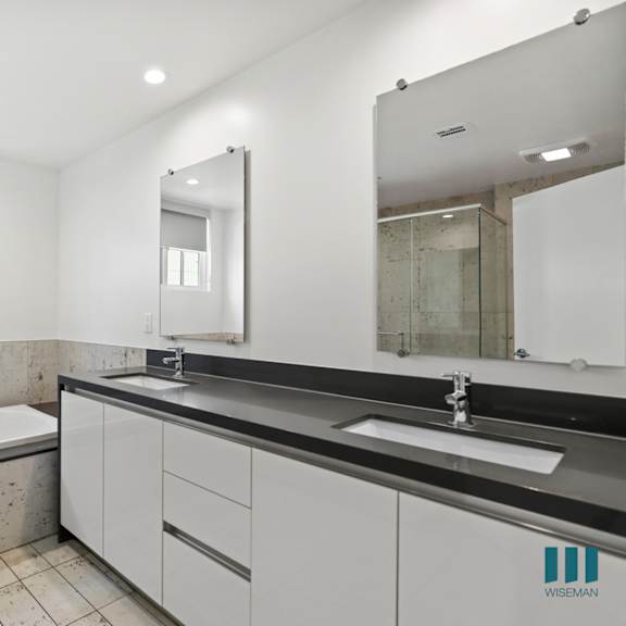 large-size bathroom with bathtub and double-sink vanity