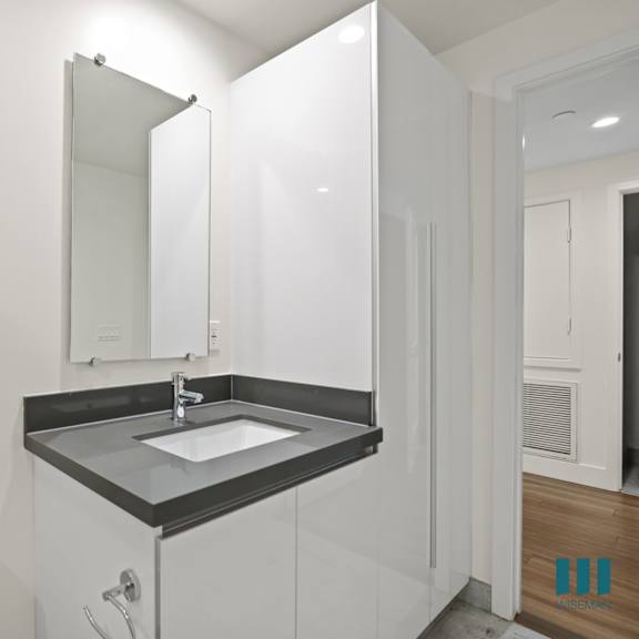 bathroom with additional cabinet storage