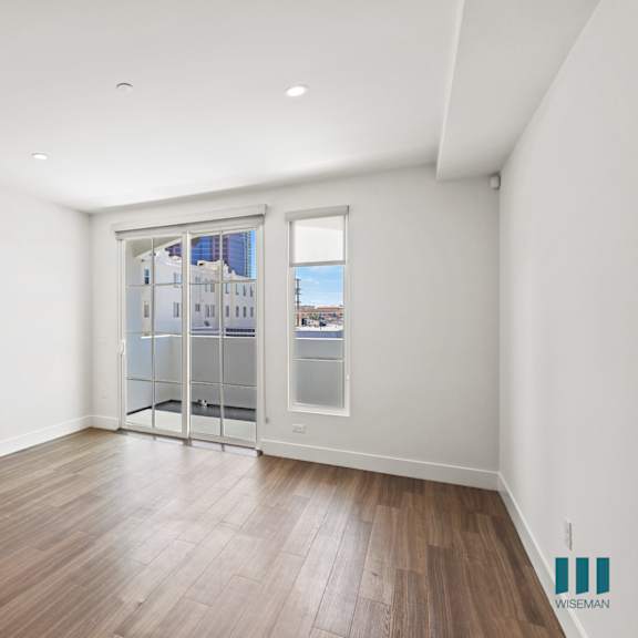 bedroom with patio access, vinyl flooring, and recessed lighting