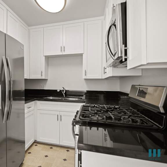 kitchen with energy-efficient appliances and cabinet storage