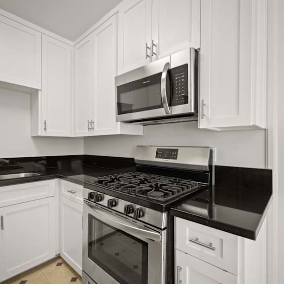 kitchen with stainless-steel stove and microwave oven