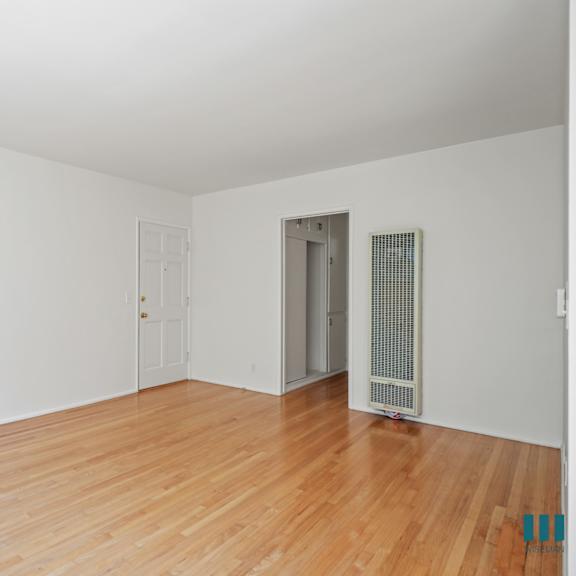 front entry and living room with vinyl flooring