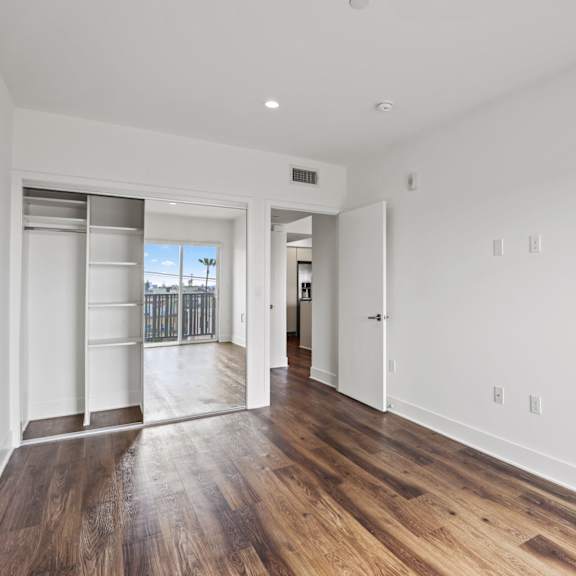 large-size bedroom with closet with shelving