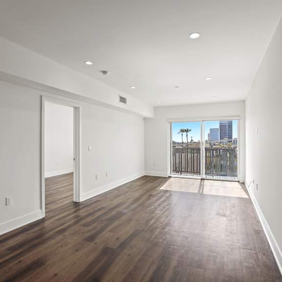 spacious living room with recessed lighting and vinyl flooring