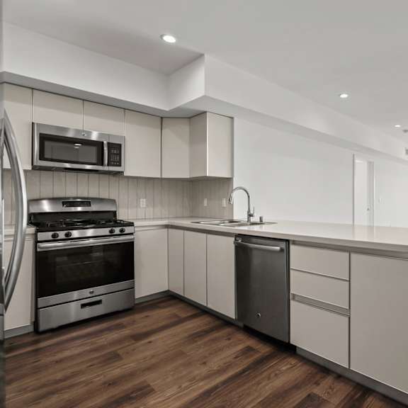 open-concept kitchen, dining, and living room space