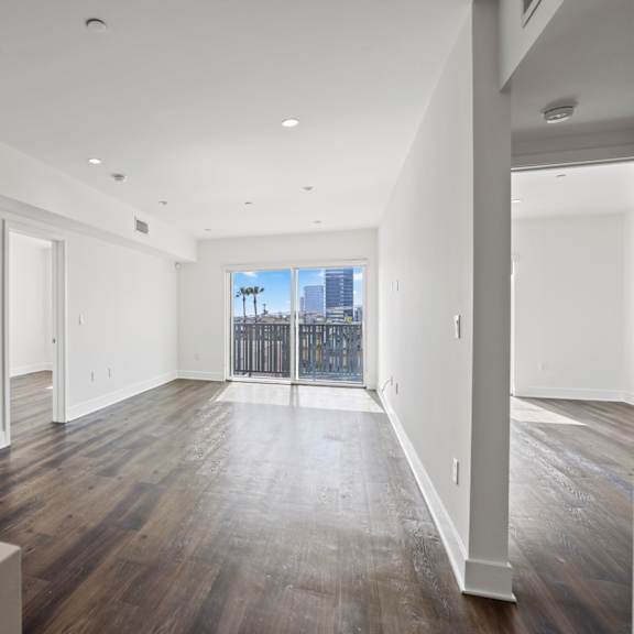 dining and living room space with patio