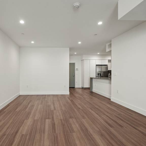 open-concept kitchen, dining, and living room areas