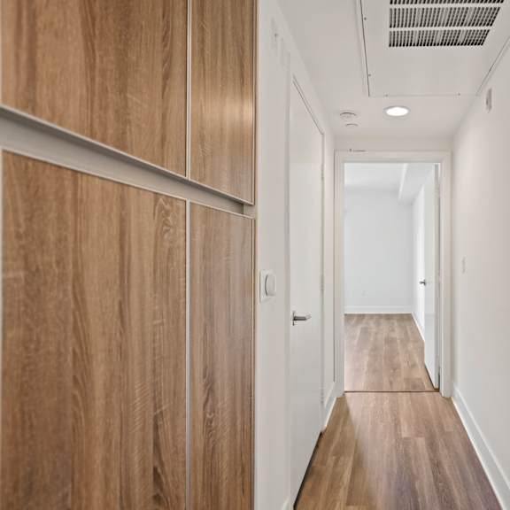 hallway with built-in cabinet storage