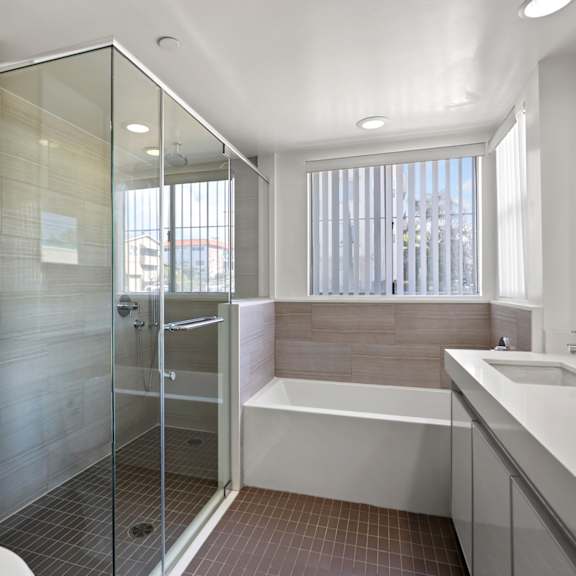bathroom with full-size shower and bathtub