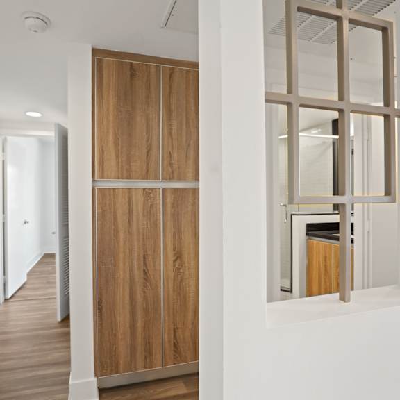 hallway with built-in storage closets