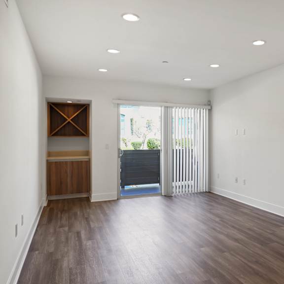 living room with built-in bar and patio