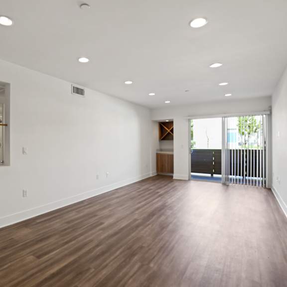 open-concept dining and living room space with patio