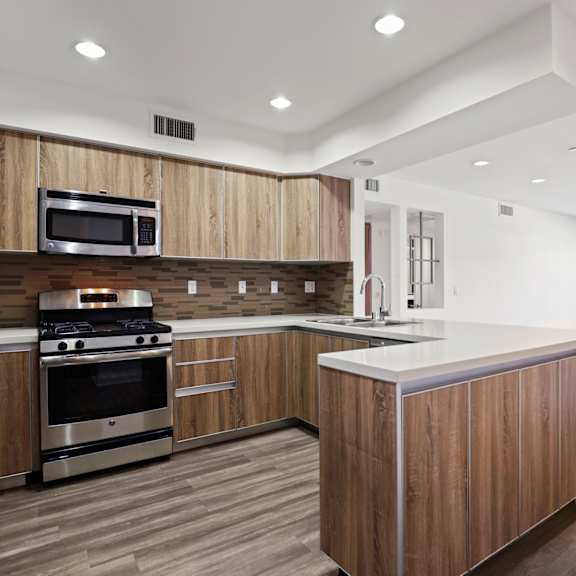 open-concept kitchen with energy-efficient appliances and ample cabinet storage