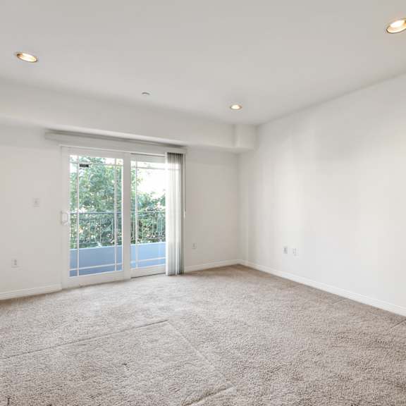 spacious bedroom with recessed lighting, carpet, and balcony