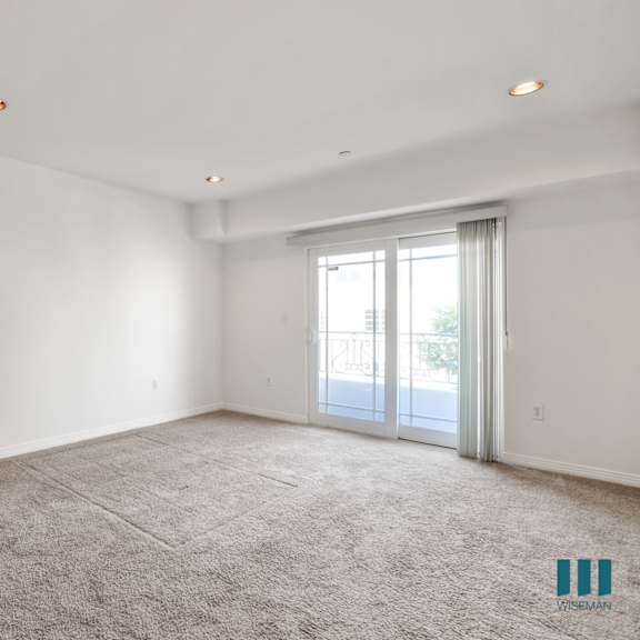 bedroom with closet, carpet, recessed lighting, and balcony