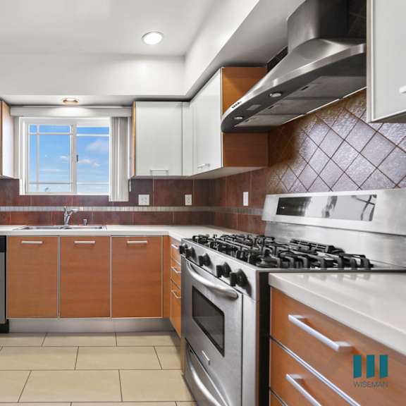 kitchen with stainless steel appliances and ample cabinet storage