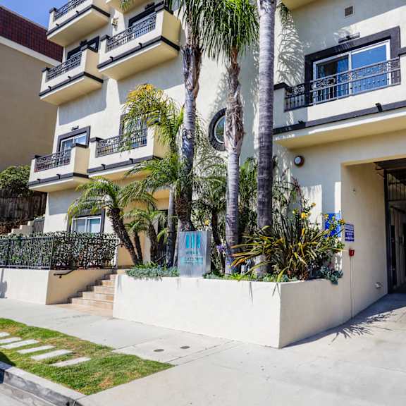 front entrance of building and resident garage