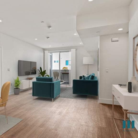 open-concept dining, living room, and patio with recessed lighting and vinyl flooring