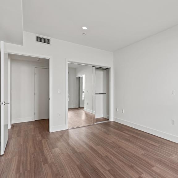 bedroom with two mirrored closets