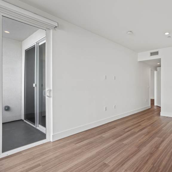 bedroom with reecessed lighting, vinyl flooring, and patio
