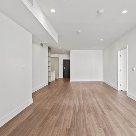 open-concept kitchen, dining, and living rooms
