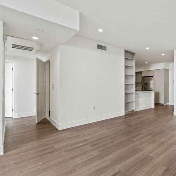 dining room area with built-in shelving, vinyl flooring, and recessed lighting