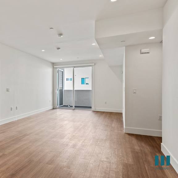 open-concept dining and living room with vinyl flooring, recessed lighting, and patio