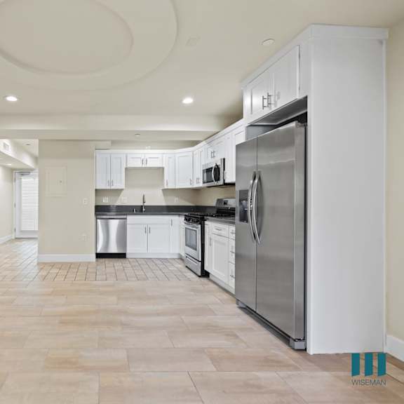open kitchen, dining, and living room spaces