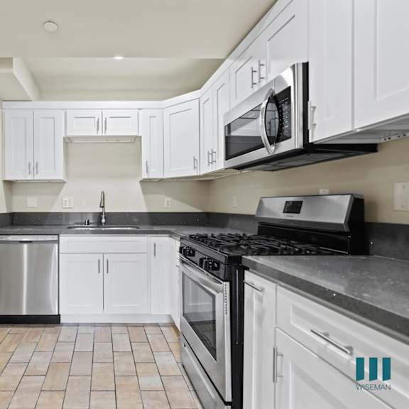 kitchen with stainless-steel dishwasher, stove, and microwave oven
