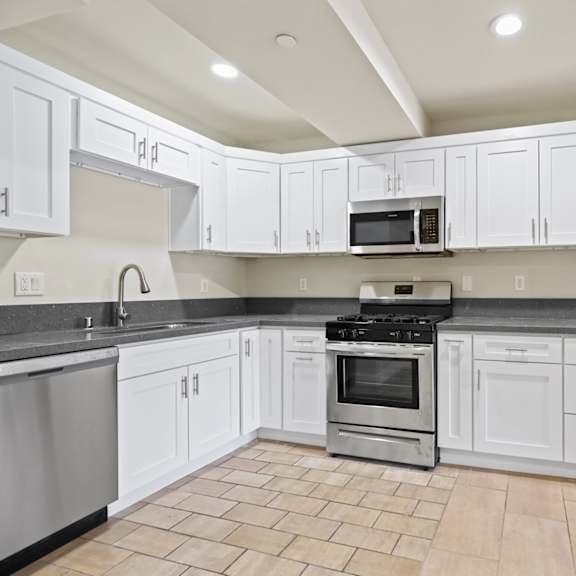 kitchen with stainless steel appliances and ample cabinet storage