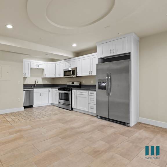 open-concept kitchen, dining, and living room areas